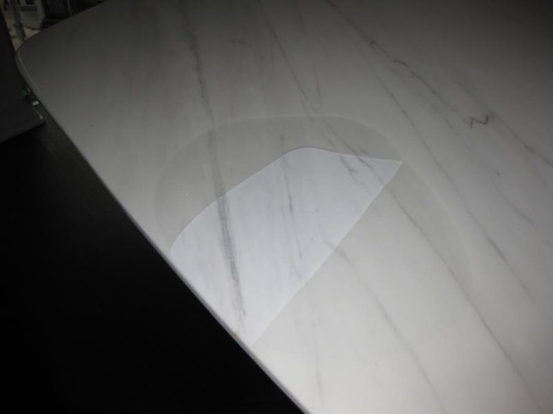 Defective Acrylic Coating on Marble Dining Table is detaching from stone surface