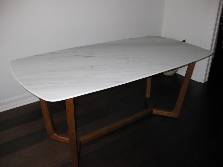 After pic of a refinished dining table with defective acrylic coating removed and polished to a honed finish to reveal the natural beauty of the white carrarra marble.